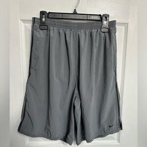 2 pairs of Nike Dry Fit shorts with attached underwear and Champion shorts sz XL